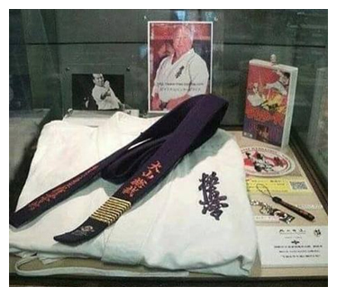 Folded karate dogi with belt