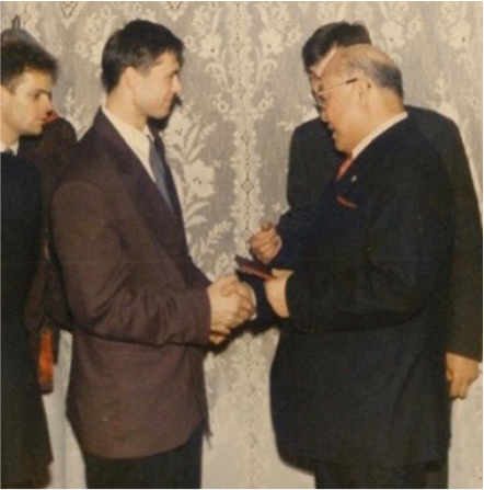 Two men greeting with respect